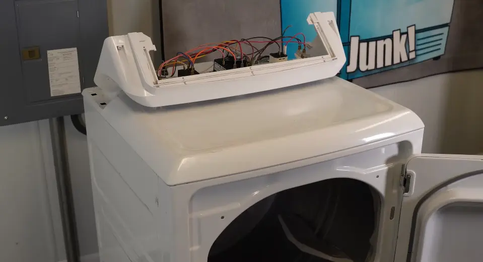 Dryer making noise — worn drum support roller or belt causing squealing and thumping