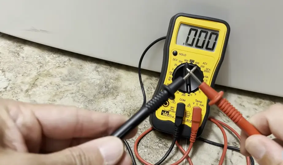 Dryer not heating — technician inspecting heating element and thermal fuse